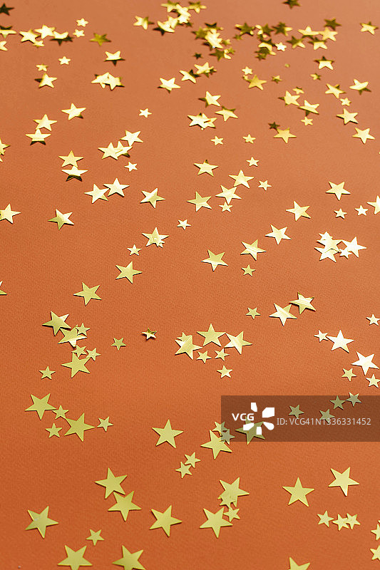 橙色背景与金色星星图片素材