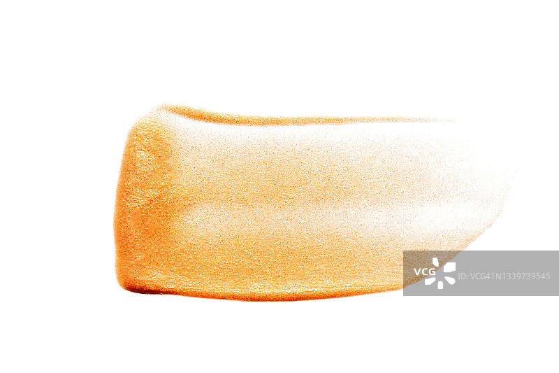 带有闪光颗粒的青铜色眼影纹理涂抹，带有珠光的润肤露或防晒油，完美的晒黑效果，平板风格的微距摄影图片素材