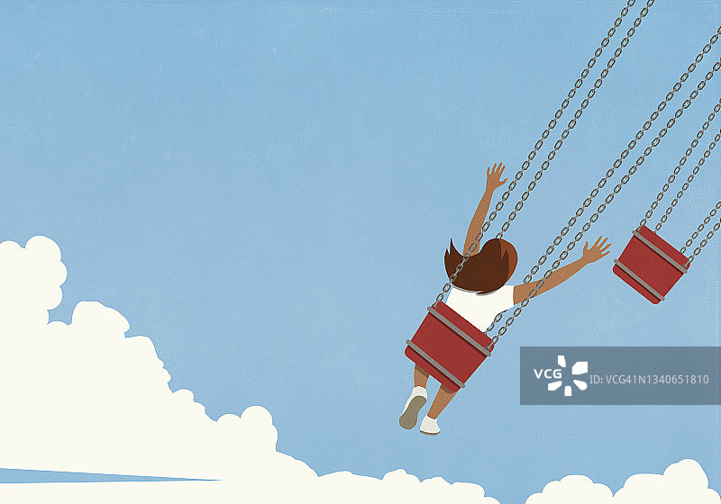 在蓝天下荡秋千的快乐女孩图片素材