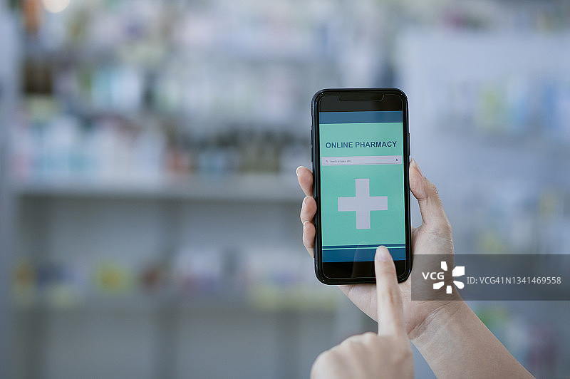 女性手在线购买药品图片素材