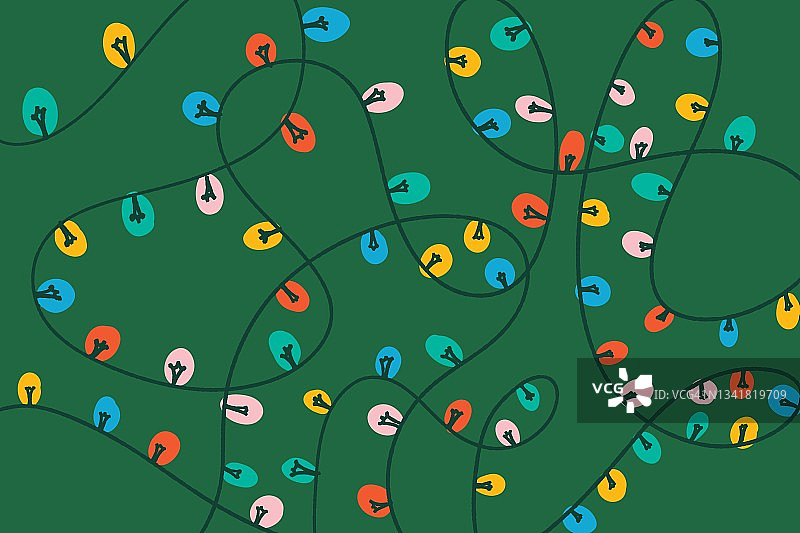 绿色背景上的彩色圣诞灯饰图片素材