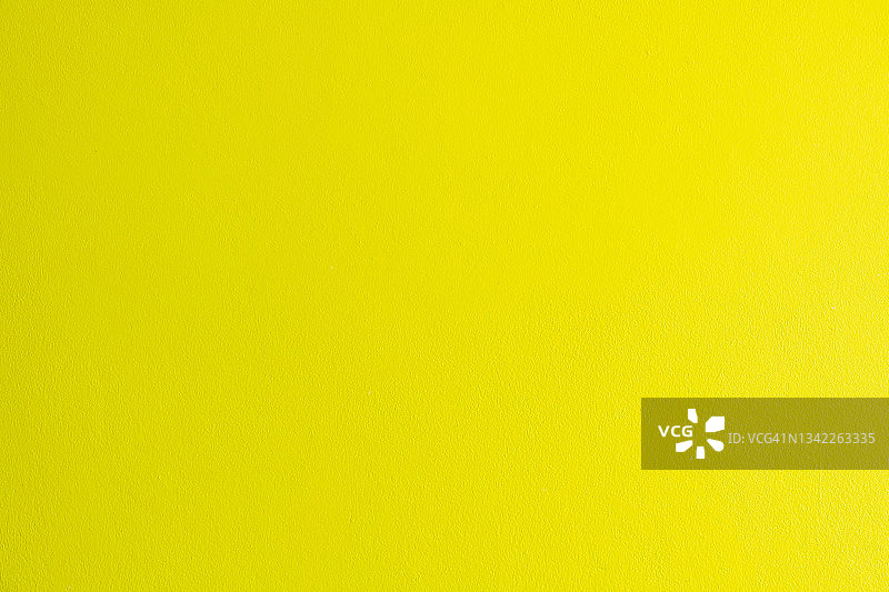 石灰黄色水泥墙的纹理和背景，绿黄色图片素材