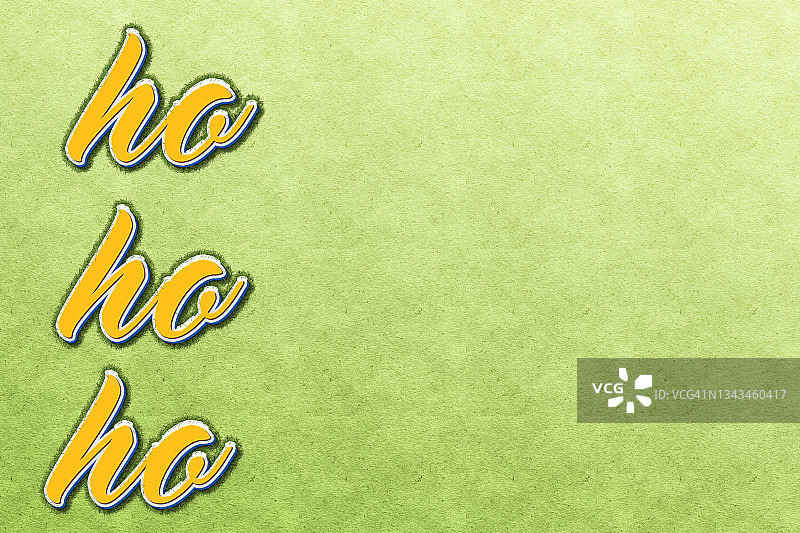 绿色毛毡背景上的Ho Ho Ho文本，带有复制空间图片素材