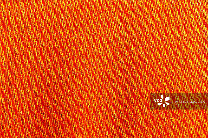 橙色运动服装面料足球衫球衣纹理和纺织背景图片素材