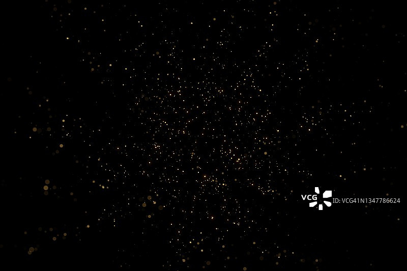 黑色背景上的金色节日粉尘，新年或生日庆祝概念背景图片素材