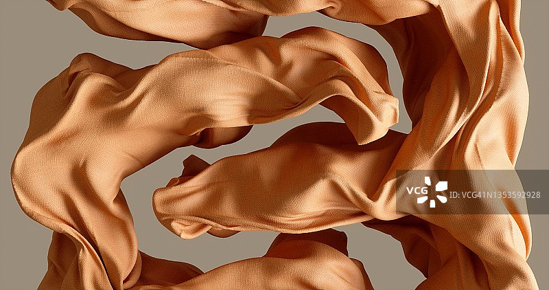 米色背景上随风飘动的棉布图片素材