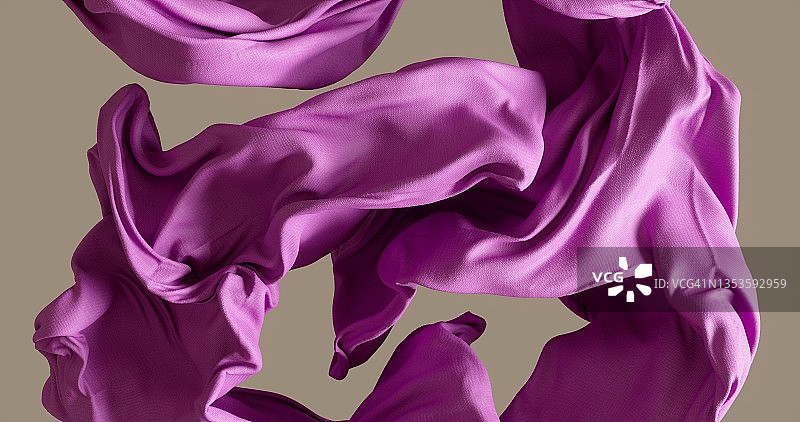 米色背景上随风飘动的棉布图片素材