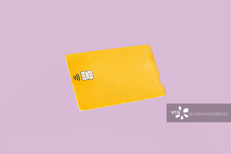 粉色背景上的黄色信用卡图片素材