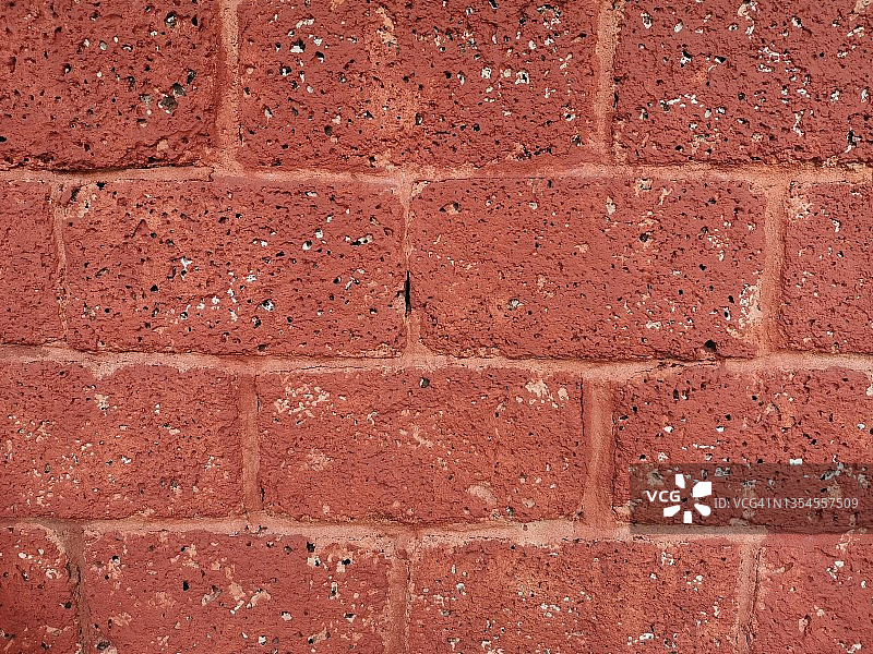 用于装饰的红色石块墙面粗糙表面纹理材料背景图片素材