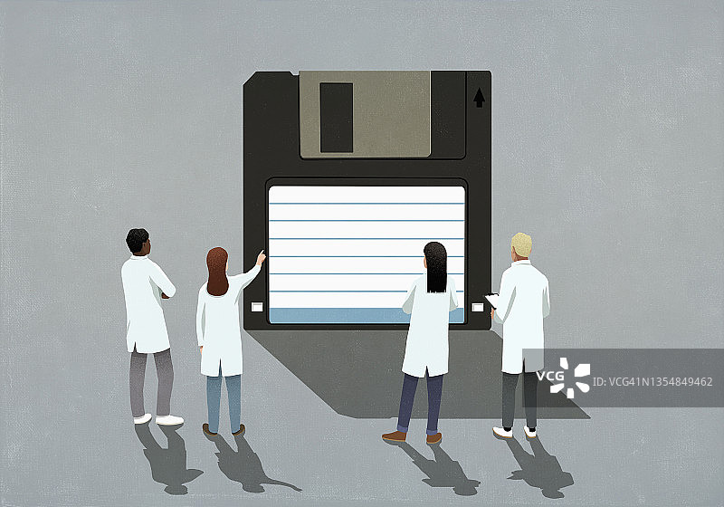 科学家身穿实验服查看软盘图片素材