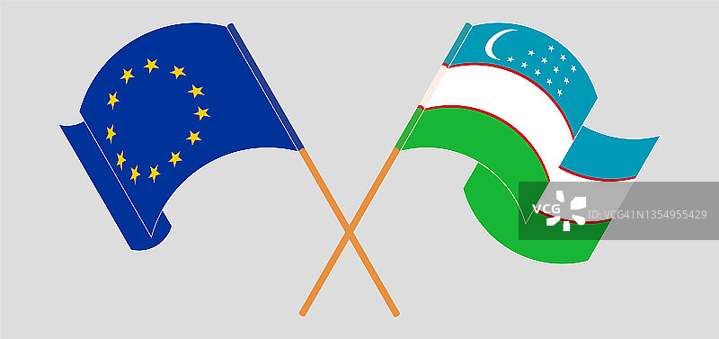 欧盟与乌兹别克斯坦交叉挥舞的旗帜图片素材