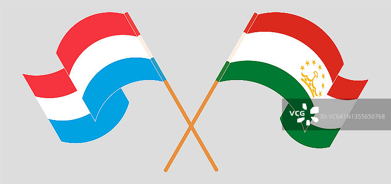 卢森堡和塔吉克斯坦交叉飘扬的旗帜图片素材