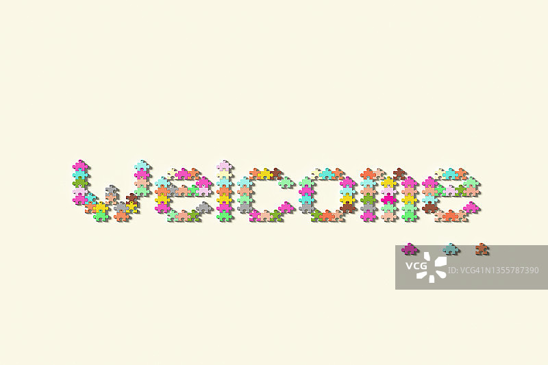 用彩色人形拼图拼写的单词“欢迎”图片素材