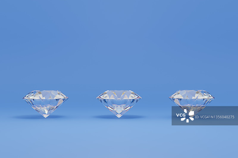 蓝色背景上的三个钻石图案图片素材
