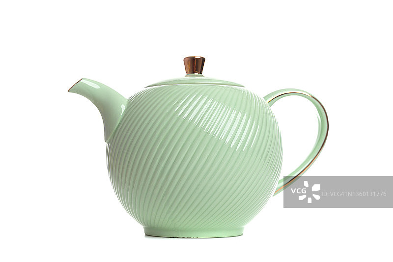 白色背景上的浅绿色瓷茶壶图片素材