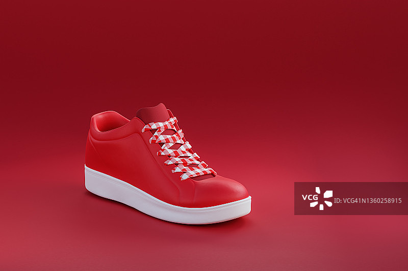 单只红色格子鞋带白色鞋底的鞋子图片素材