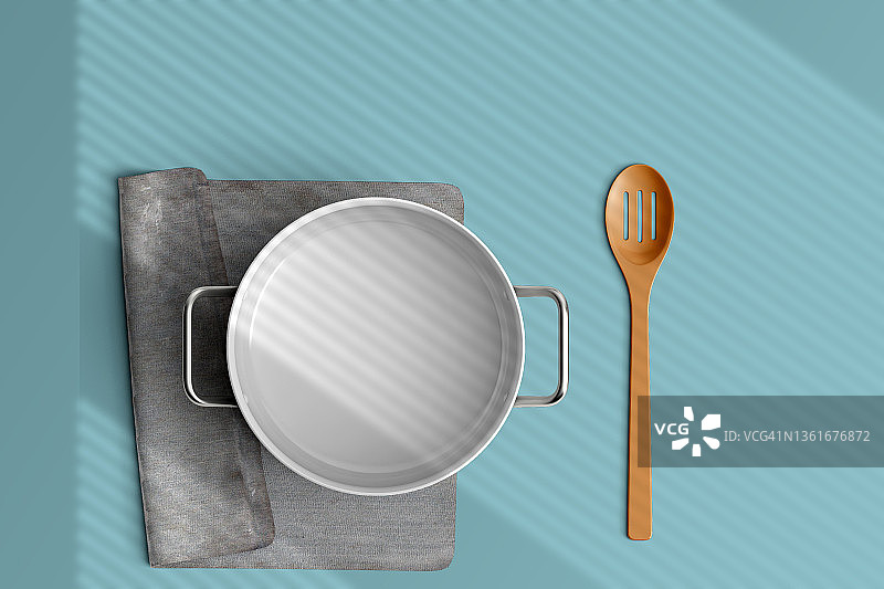 俯视蓝色背景下的空锅图片素材