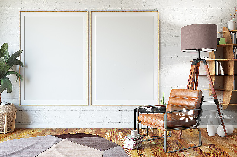 室内白色墙壁上带有扶手椅和书籍的两个竖版空白海报样机图片素材