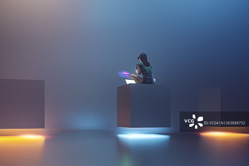 年轻女人使用笔记本电脑体验VR图片素材