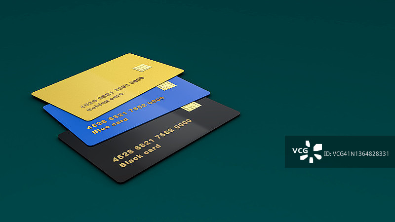 绿色背景桌上的三张信用卡图片素材