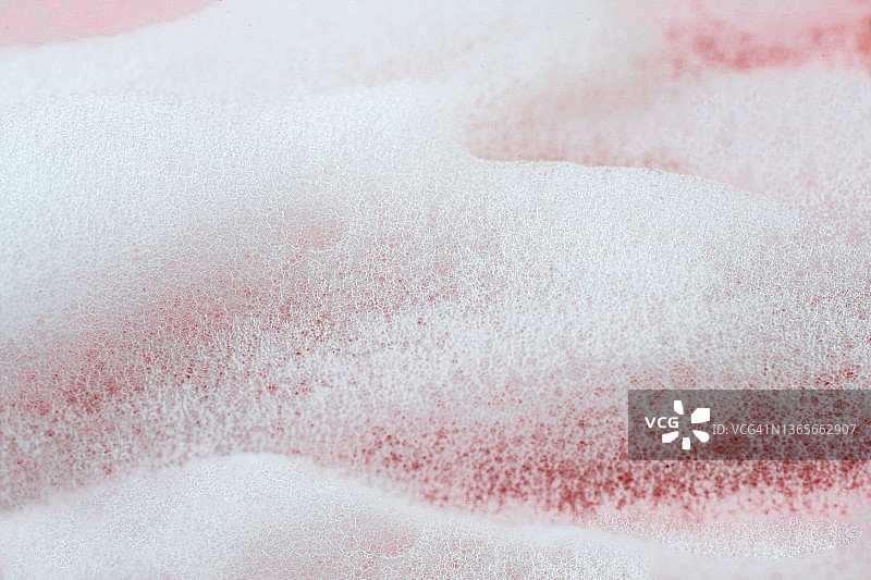 粉色珊瑚玫瑰色背景上的美容产品泡沫皂微距摄影图片素材