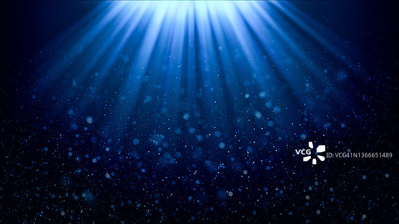 蓝色渐变背景上的光线和散焦粒子图片素材