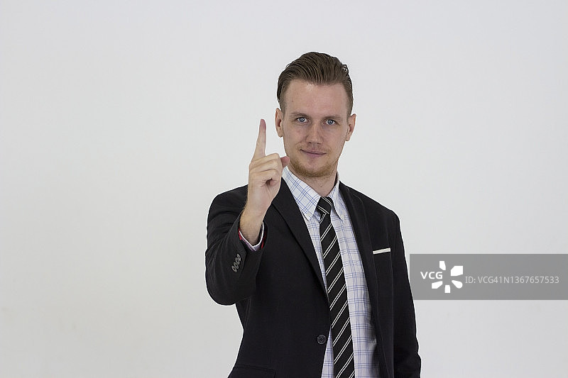商务人士竖起手指，指向成功图片素材