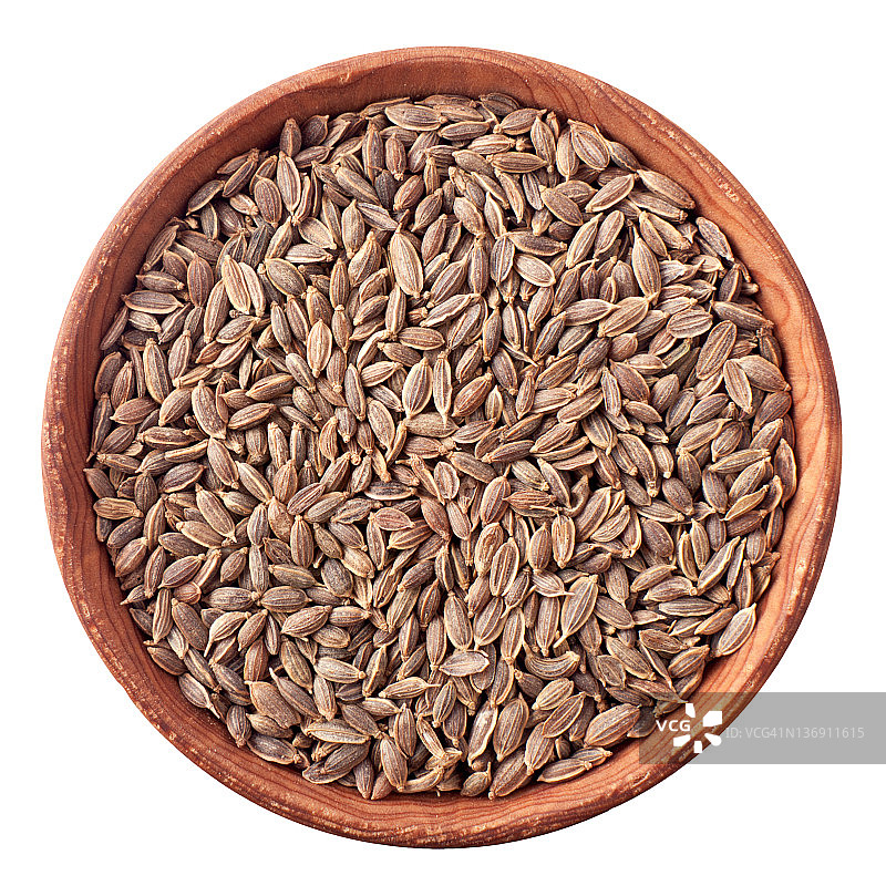 白色背景木碗里的莳萝籽图片素材