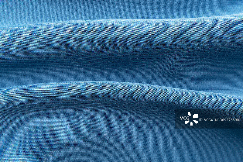 温暖柔软的蓝色布料背景图片素材