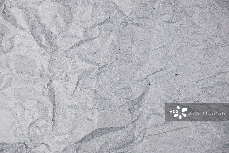 由天然灰色皱纹纸制成的抽象背景图片素材
