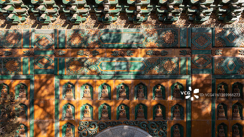 颐和园宫墙上的佛像图片素材