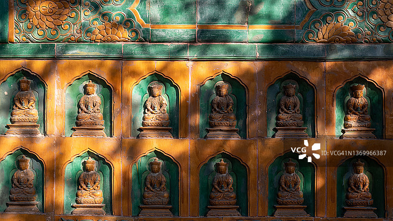 颐和园宫墙上的佛像图片素材