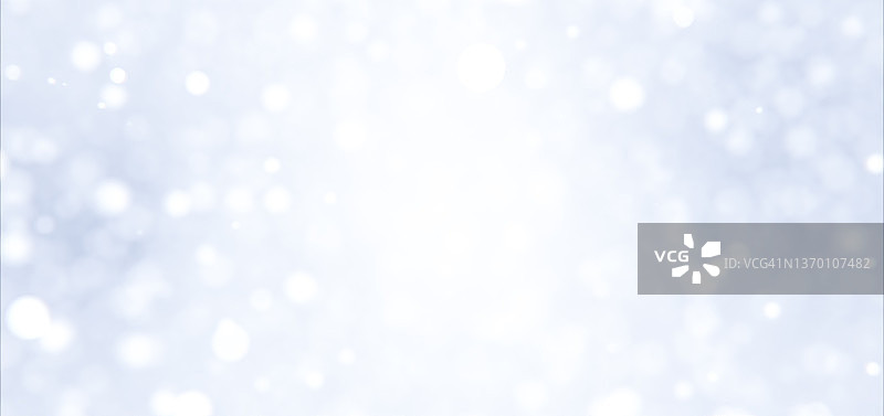 柔和蓝色渐变背景上的白色失焦灯光图片素材