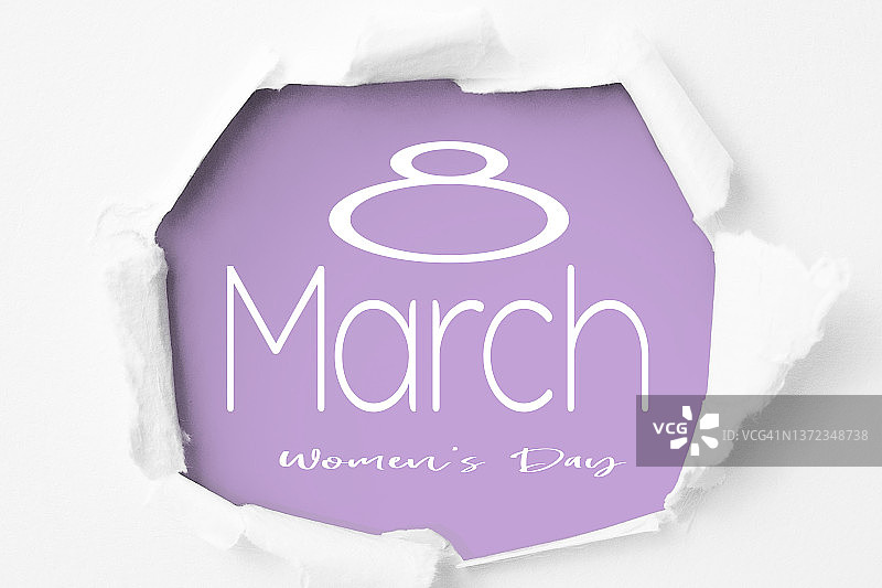 破纸而出的3月8日图片素材
