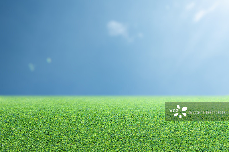绿色草坪景观与模糊的蓝天背景图片素材
