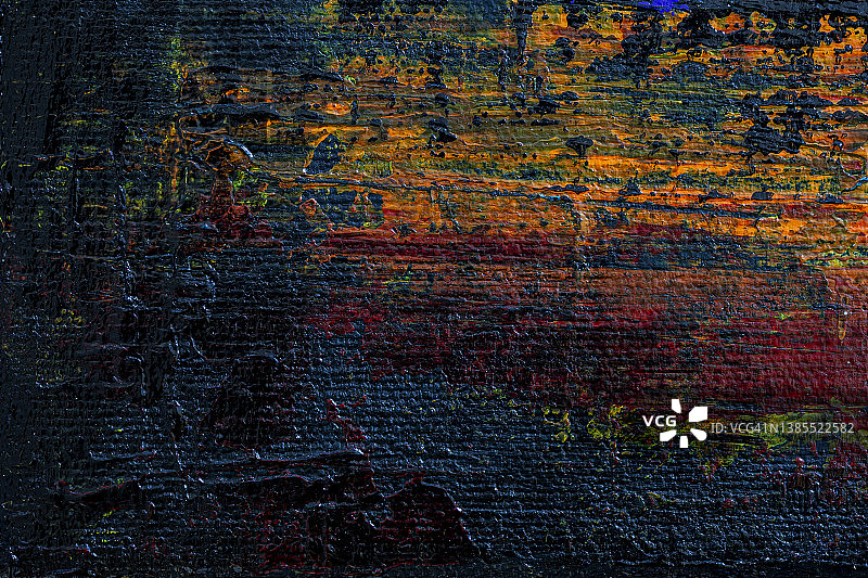 抽象的黑色、橙色和红色丙烯颜料背景特写图片素材