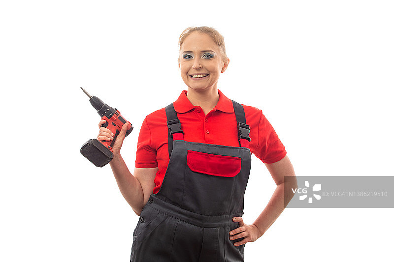拿着螺丝刀的女 работница图片素材