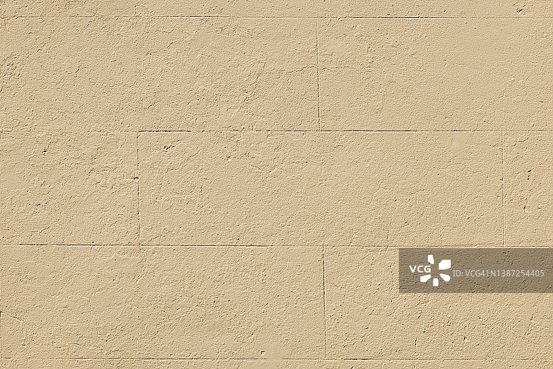 旧的、新粉刷的米色纹理混凝土墙面一角图片素材