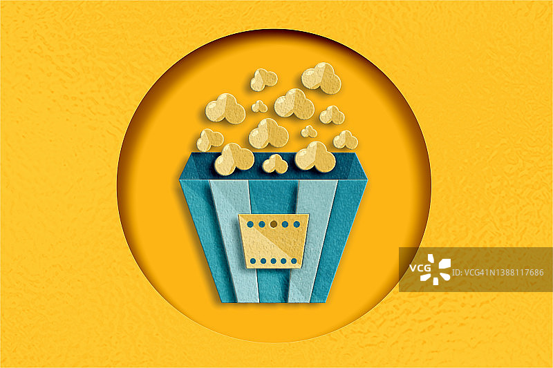 黄色背景上的爆米花和纸质文件图片素材