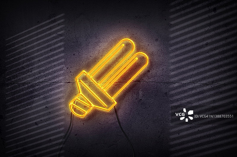 黑色砖墙上的霓虹灯灯泡图片素材