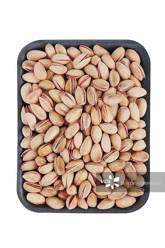 带壳开心果烤制坚果，白色背景图片素材