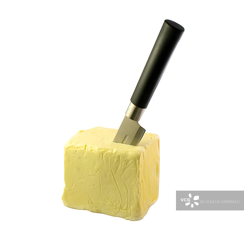 刀在白色隔离背景下的新鲜农场黄油中图片素材