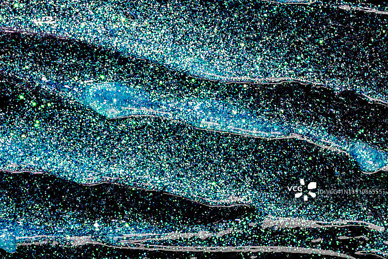 黑色背景上的蓝色闪光凝胶图案图片素材