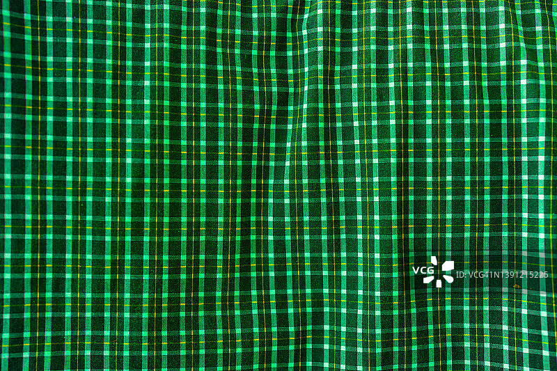 绿色网格织物纹理特写，纺织背景图片素材