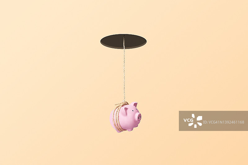 悬挂在绳子上的储蓄罐图片素材
