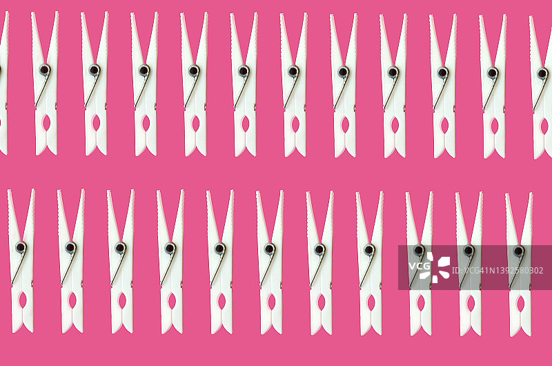 粉色背景白色衣夹无缝拼接图案图片素材