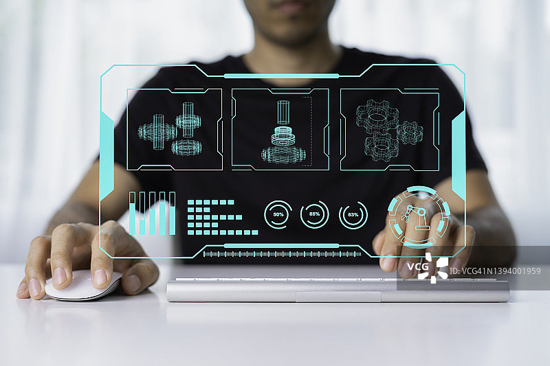 工程师们正在使用虚拟计算机监控机器人图片素材