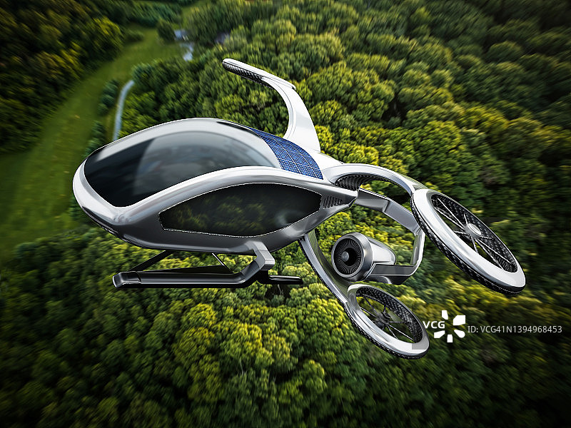 飞行于茂密森林背景下的电动垂直起降飞行器（eVTOL）概念图片素材
