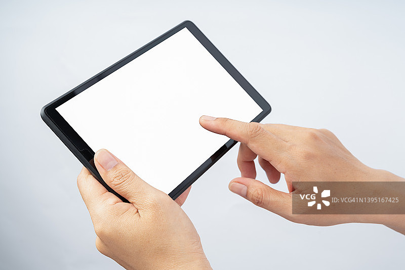 手持平板电脑，白色背景图片素材