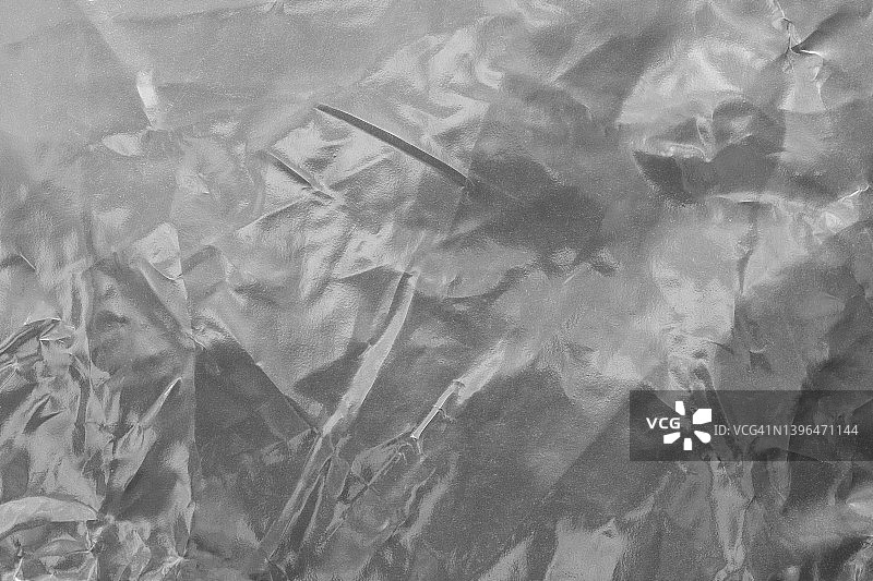 银色塑料箔背景：纸张银色抽象背景图片素材